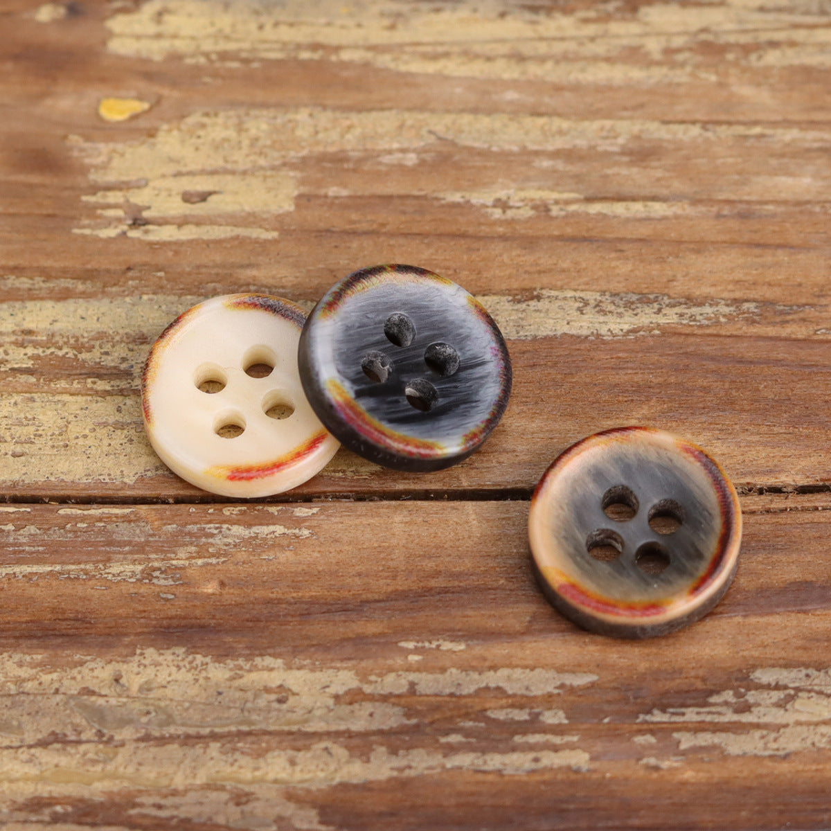 Fire-burned resin shirt buttons, cream and smoky gray, four-hole round bowl shape