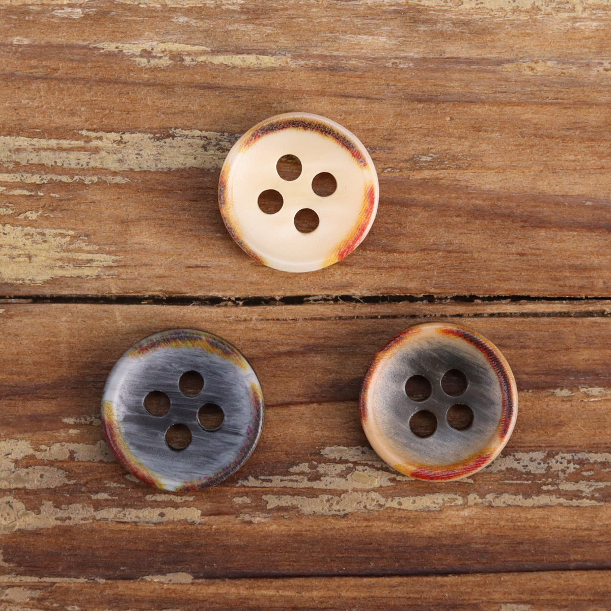 Fire-burned resin shirt buttons, cream and gray, four-hole domed bowl shape