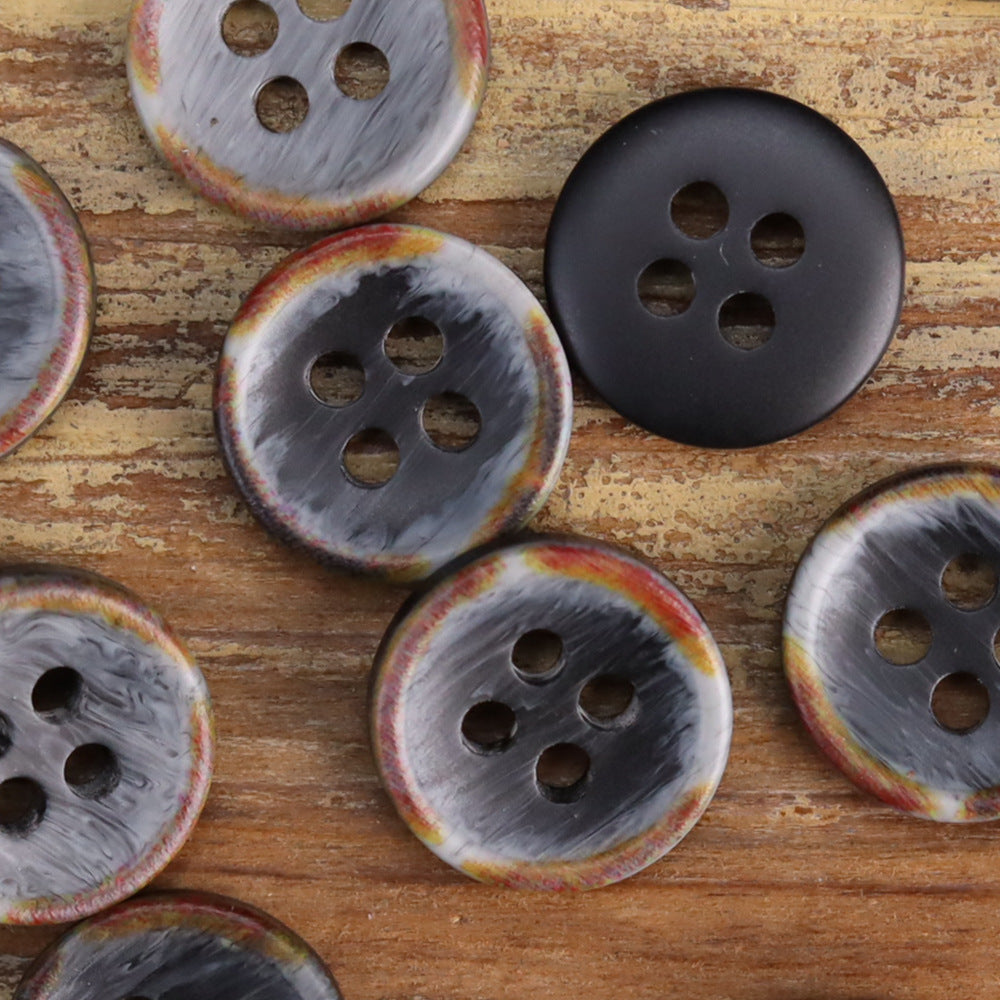 Mixed dark gray and smoky resin shirt buttons, fire-burned rim, four-hole domed shape
