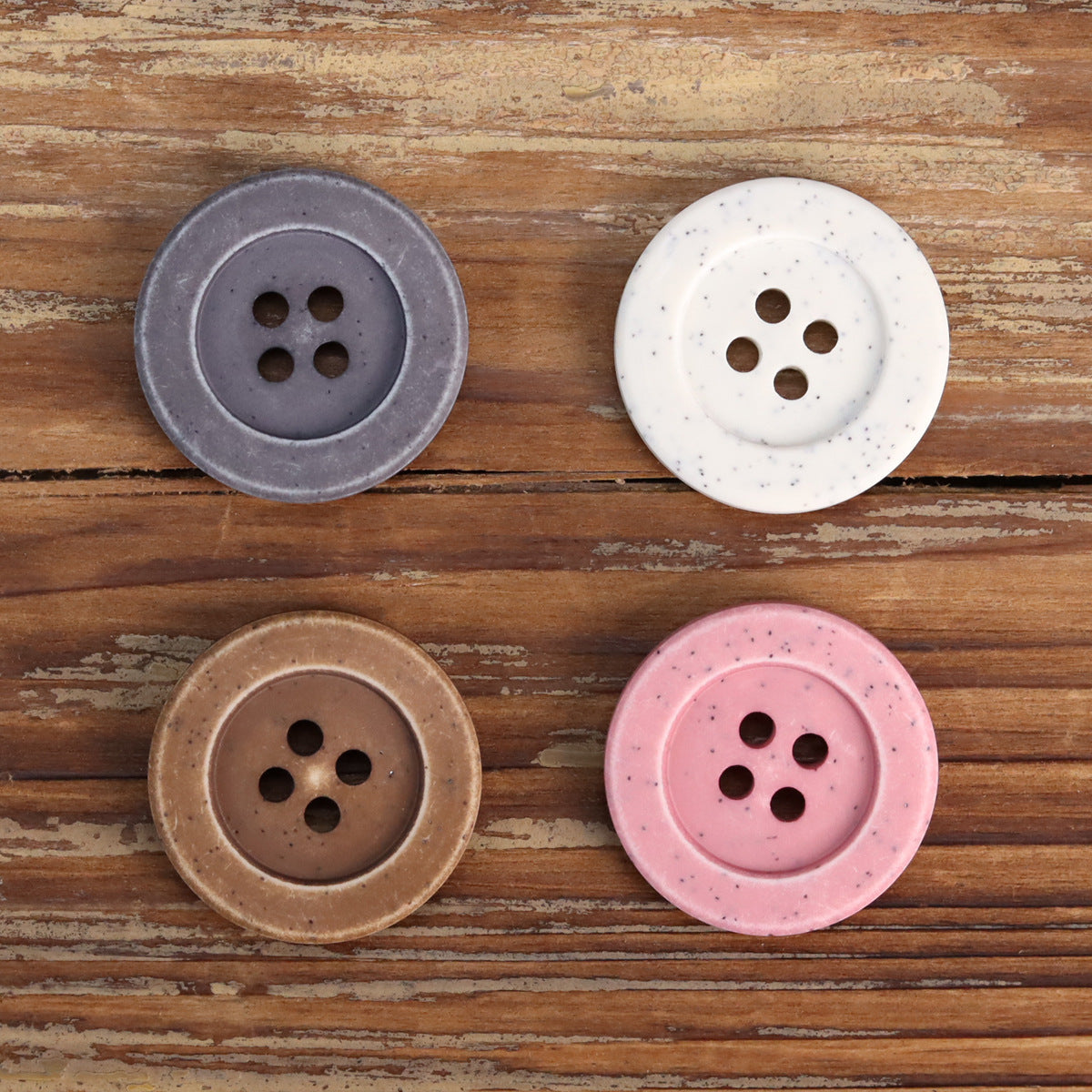 Distressed stone coat buttons in dark gray, white, coffee, and pink, each with 4 holes