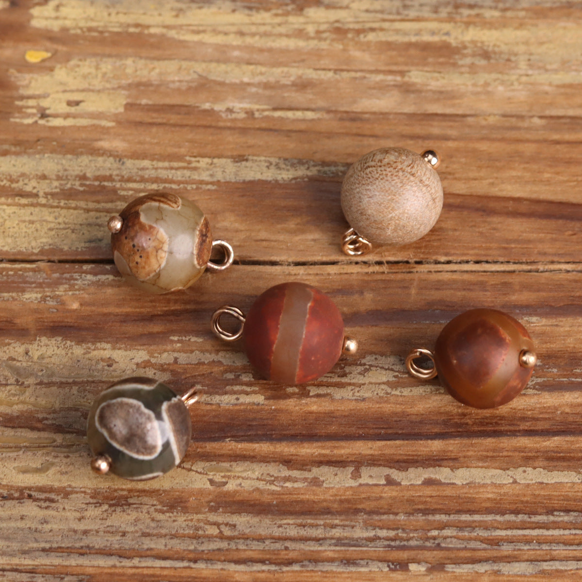 Set of agate stone button beads with metal loops in tan, red, and green tones