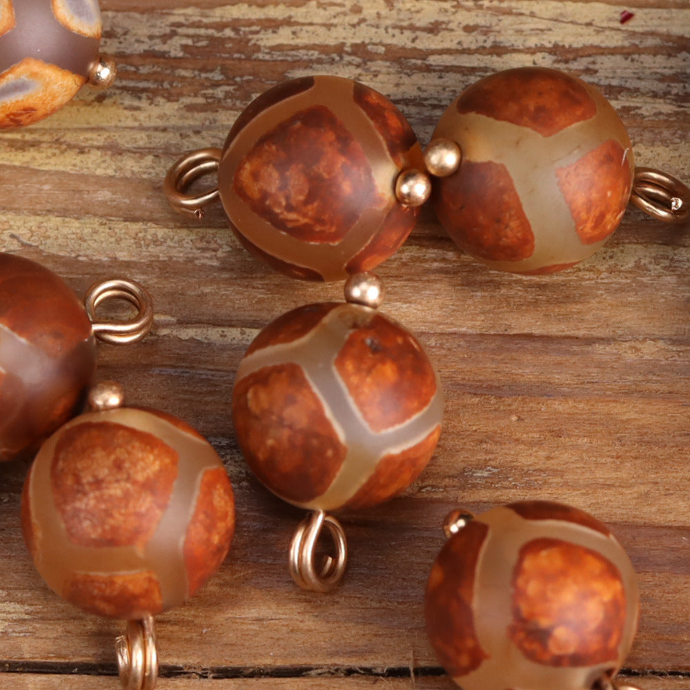Orange-brown agate Chinese button beads with metal loops in striped pattern