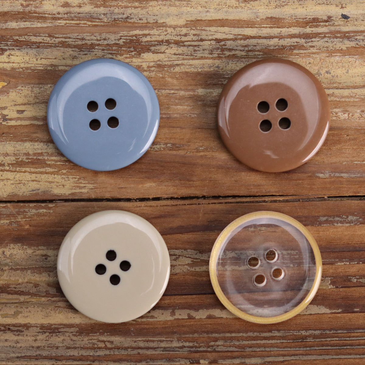 Four-hole transparent resin buttons in blue and brown, flat round jacket button set