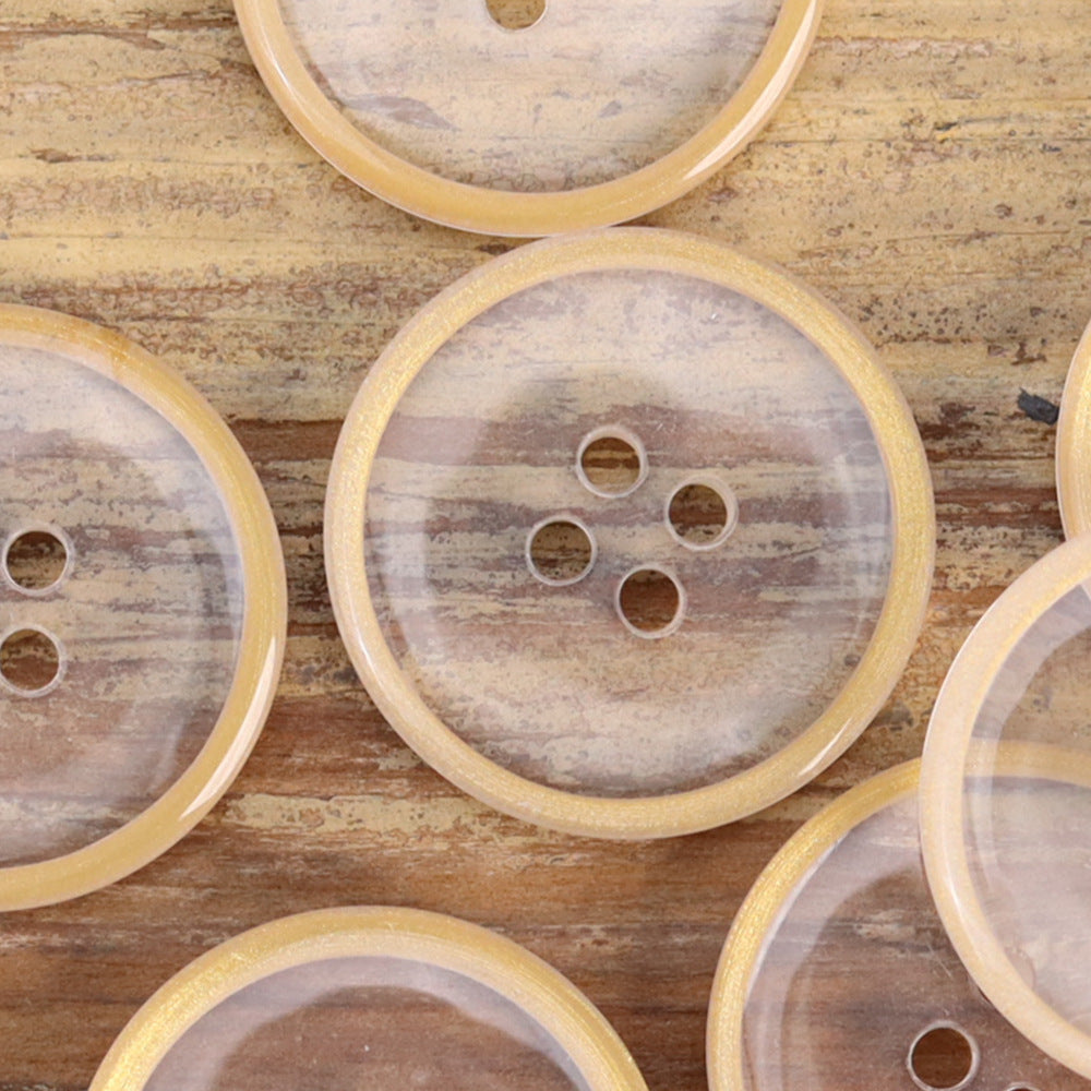 Transparent resin buttons, four-hole design with light yellow-gold edges, round shapes