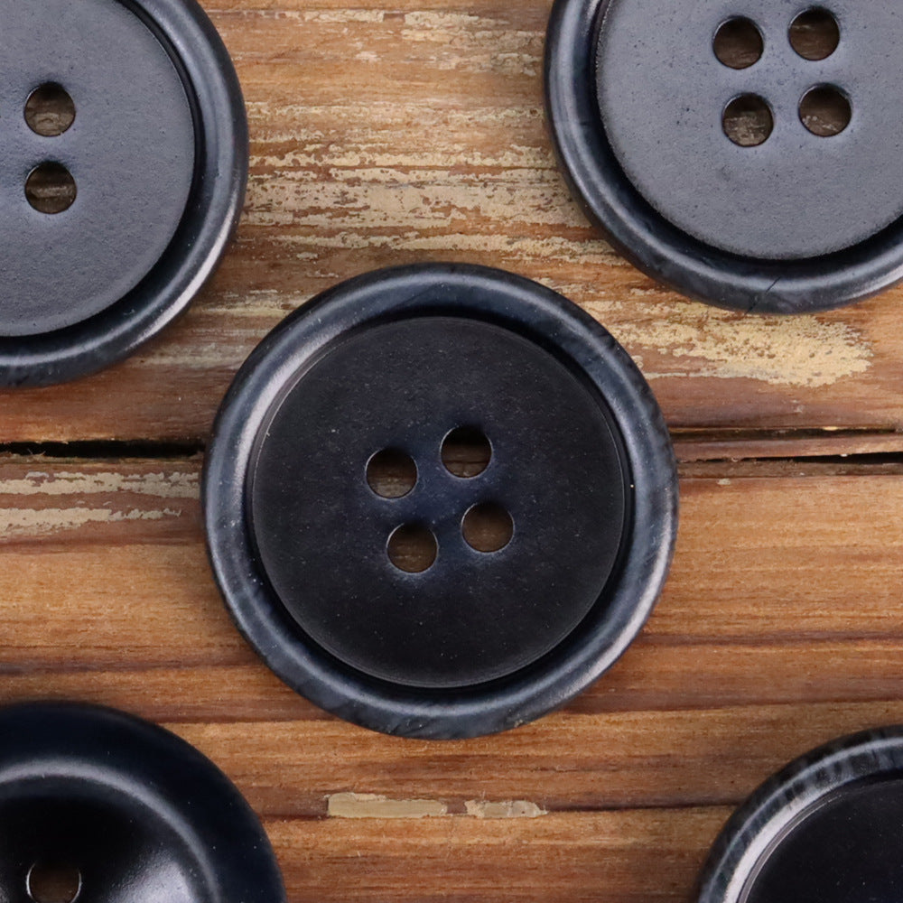 Black resin double-sided buttons, round with 4 holes and glossy edge detail.