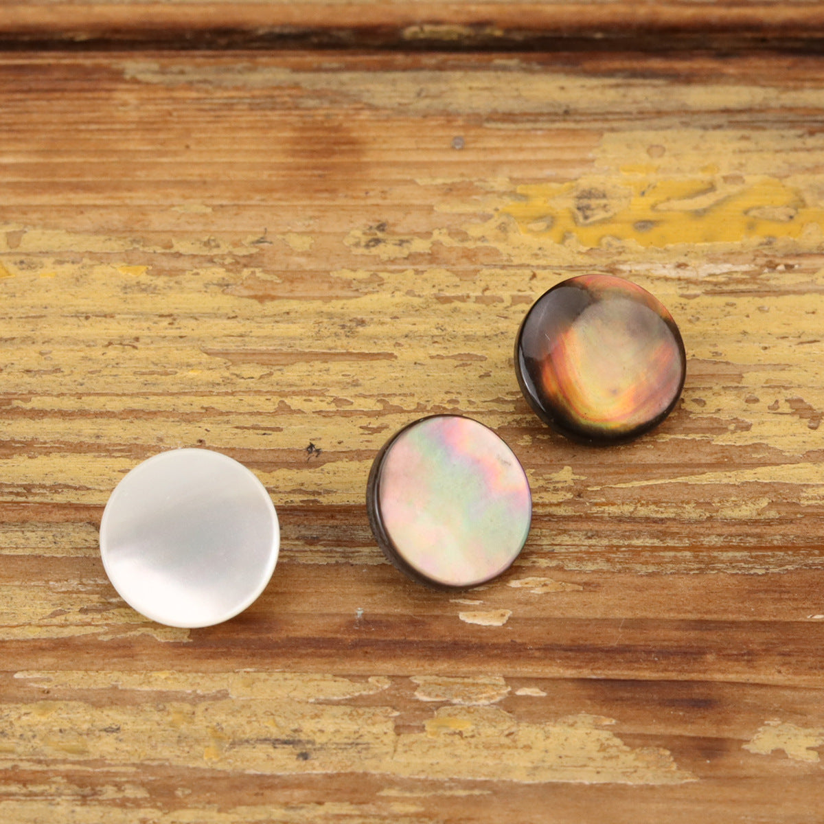 18L flat shell sewing buttons in 3 colors: white, pastel iridescent, and dark iridescent