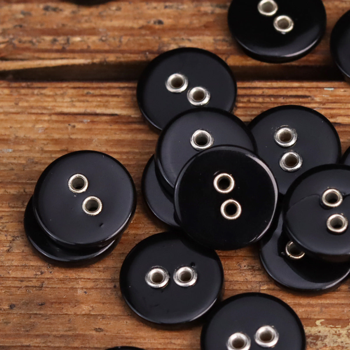 Dark 2-hole metal shell buttons, multiple round buttons with silver eyelets