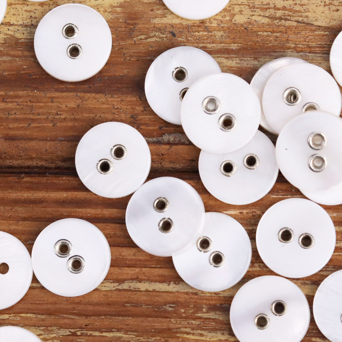White 2-hole metal shell buttons, multiple round buttons with silver eyelets