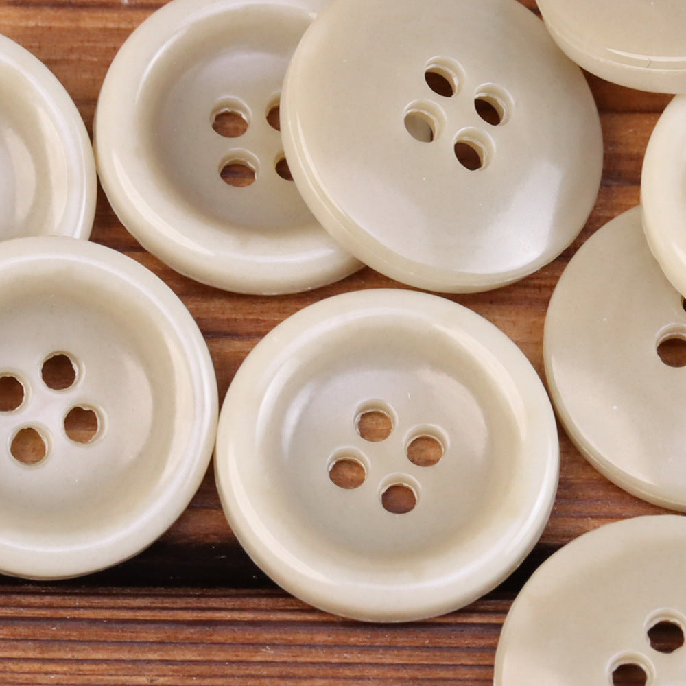 Light cream 4-hole round urea jacket buttons with imitation horn texture finish
