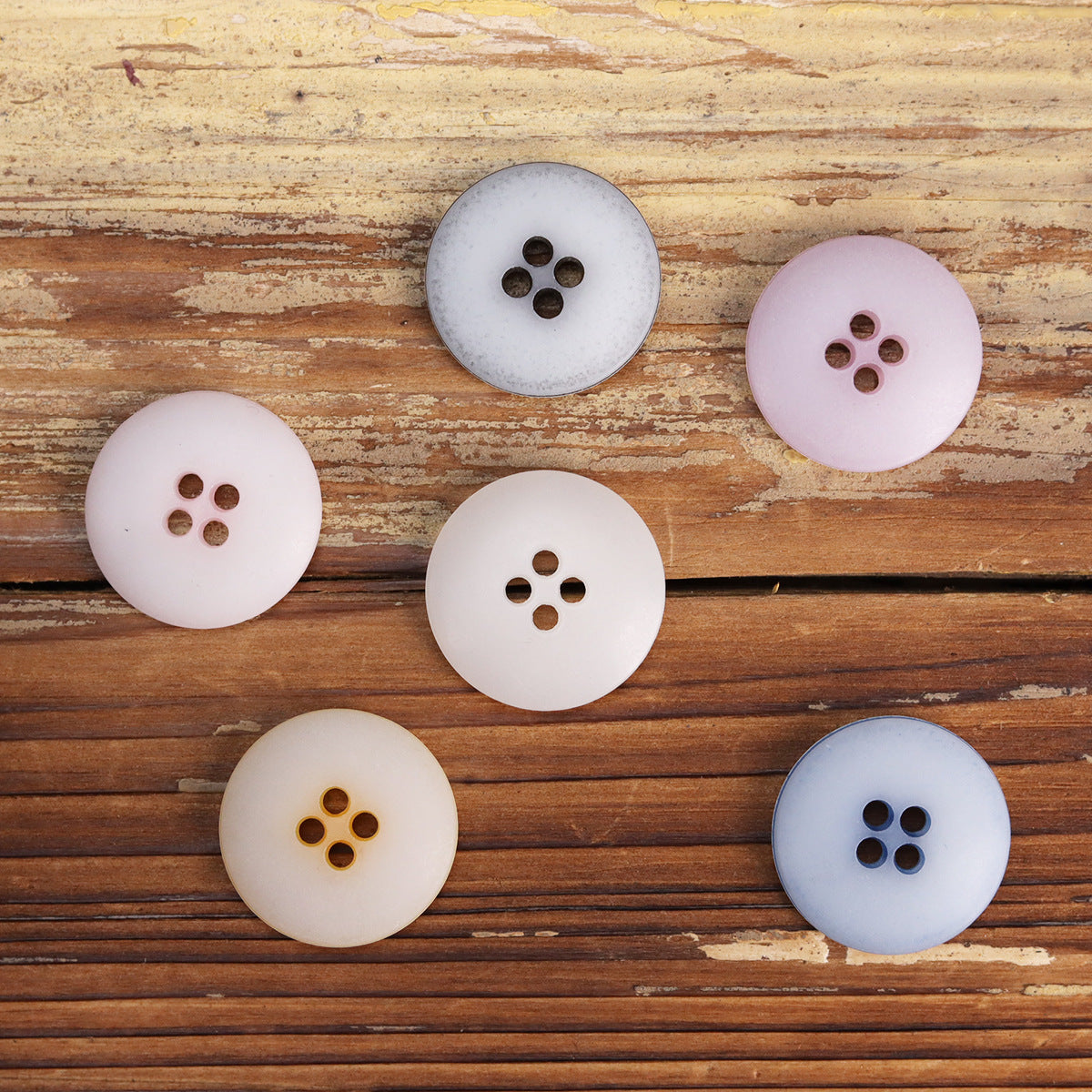 Round urea buttons, 4-hole—mix of white, pale pink, light blue, gray