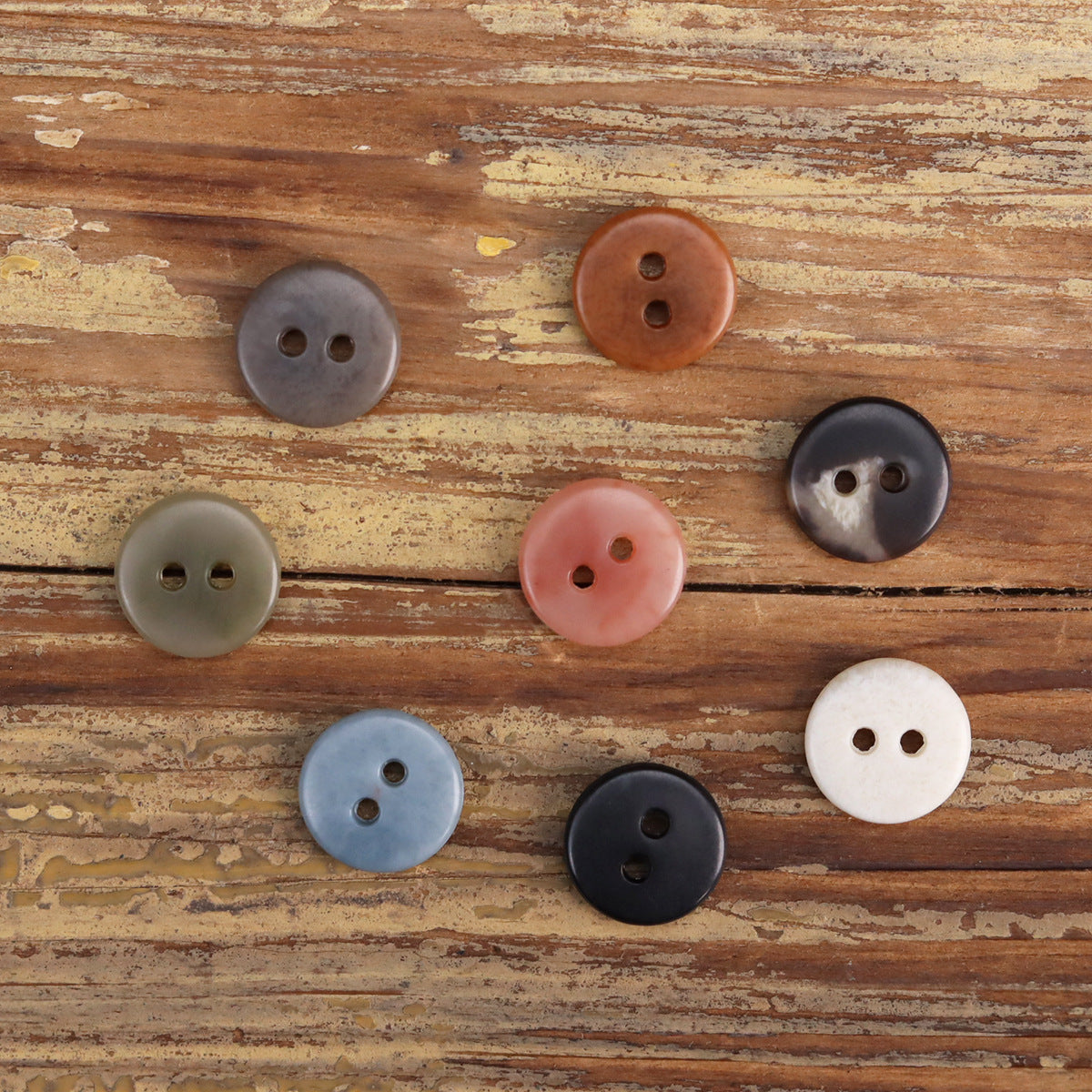 Two-eye urea buttons with 2 holes in gray, navy, pink, tan, and light blue
