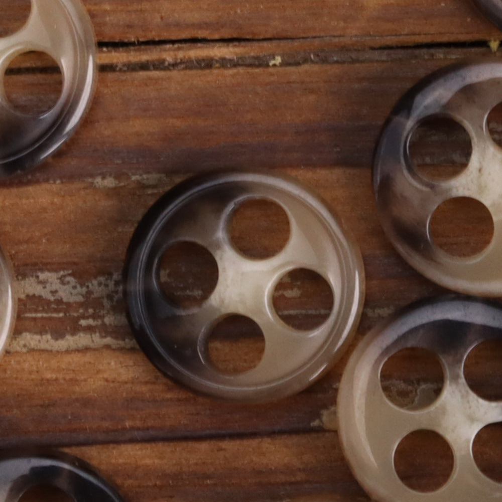 11.5mm urea buttons close-up, light and dark translucent round 4-hole style