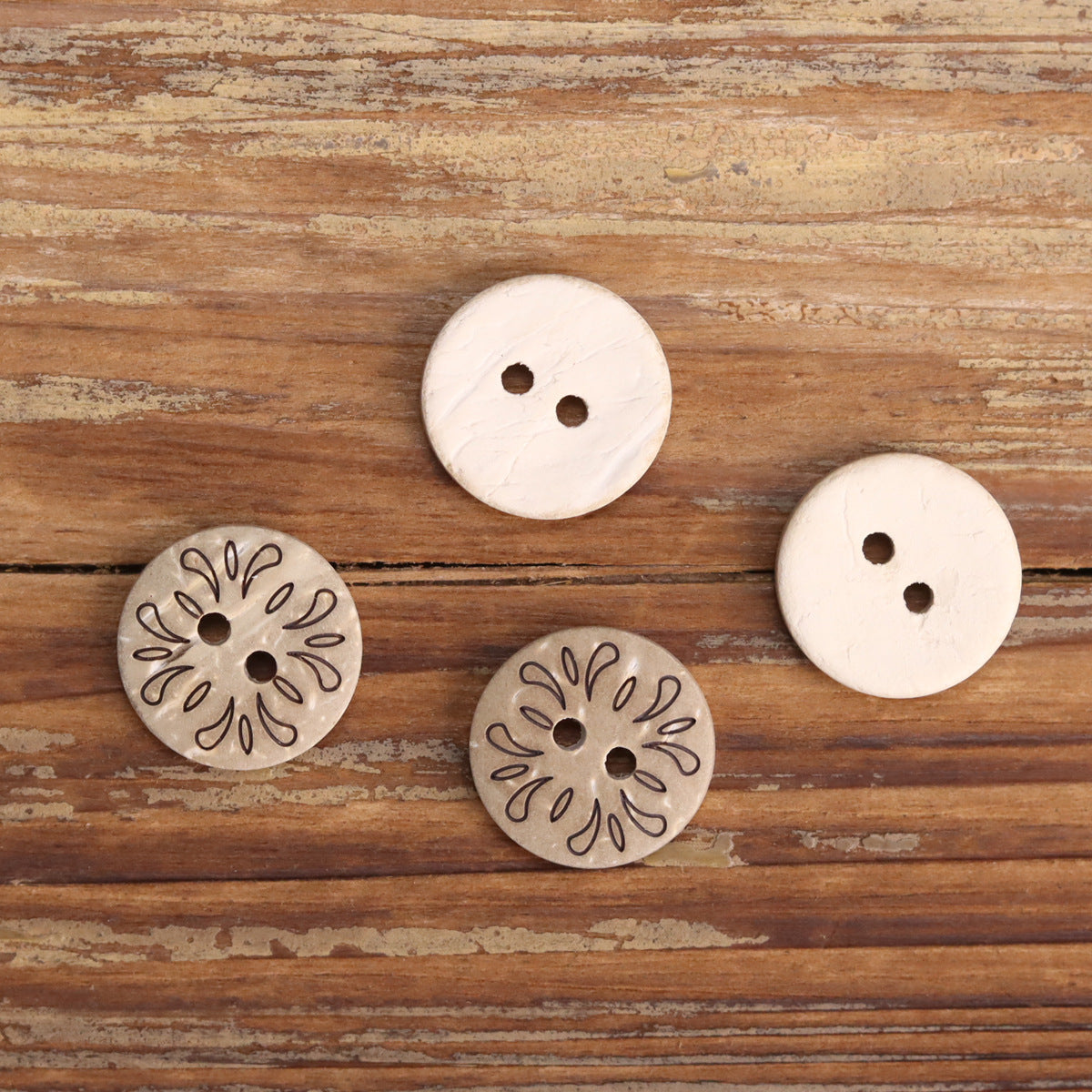 Pack of 2-hole wooden buttons: white and gray floral designs, shown together