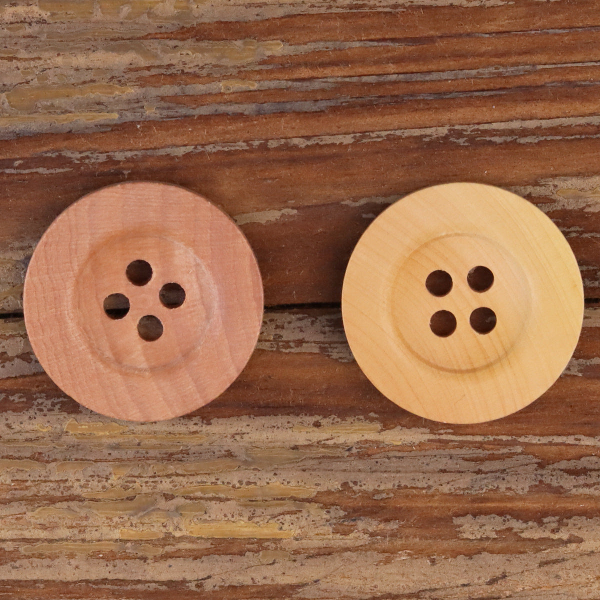Red wood and light yellow wood wide-rim four-hole buttons with round shanks