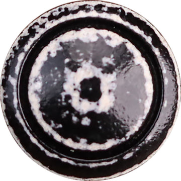 Vintage distressed black-and-white lacquered wooden button, round with worn speckle detail