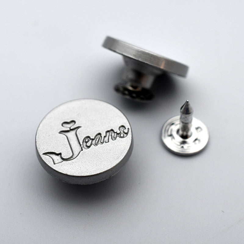 Round metal shank stud button with anchor and cursive lettering