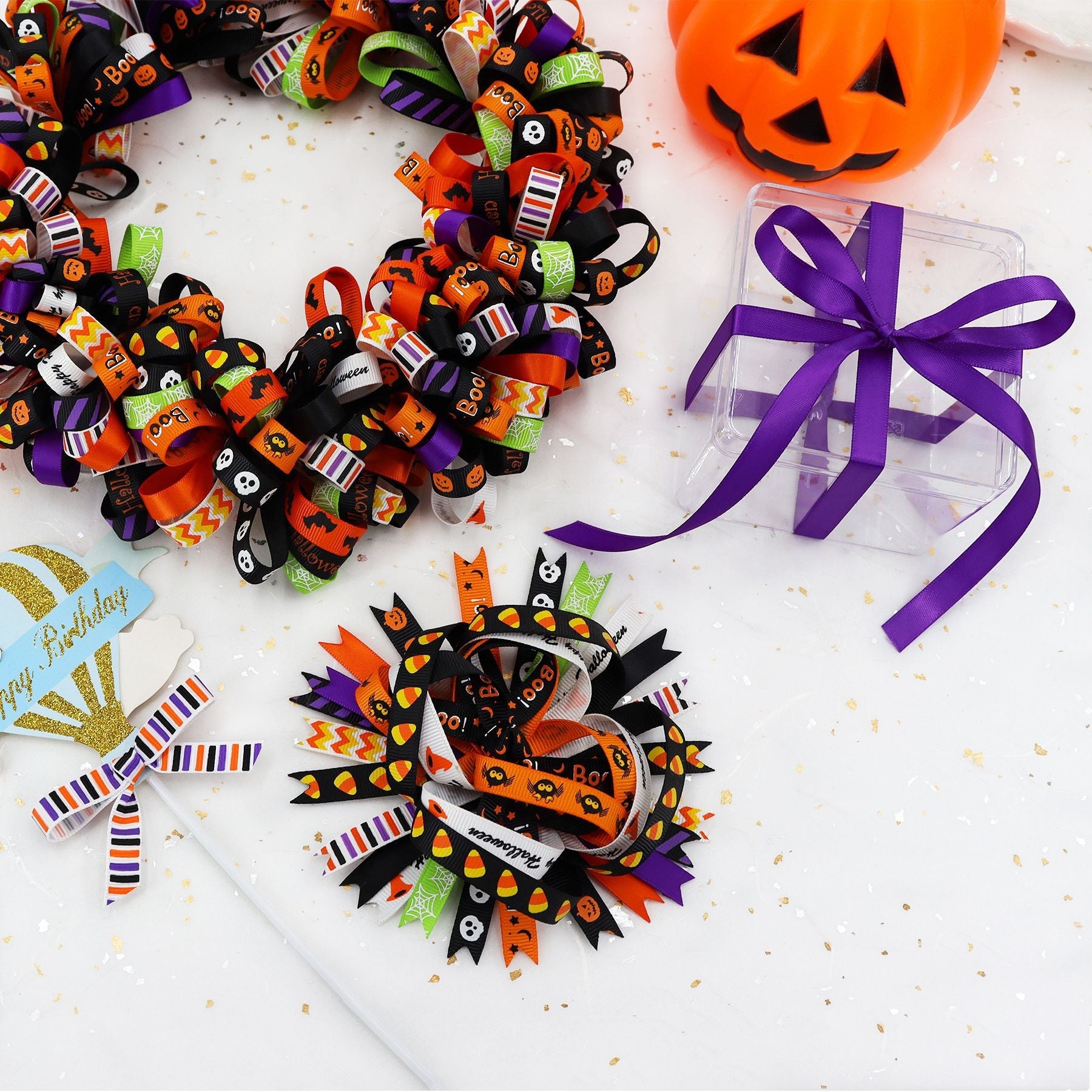 Halloween ribbon set with curled loops and bow accents; orange, purple, green, black prints