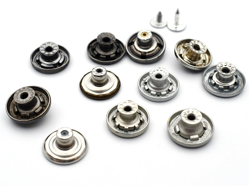 Set of round metal shank stud buttons viewed from the back, silver and gold finishes