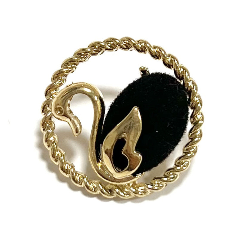 Black swan flocked button with gold edge and metal shank, oval floral detail