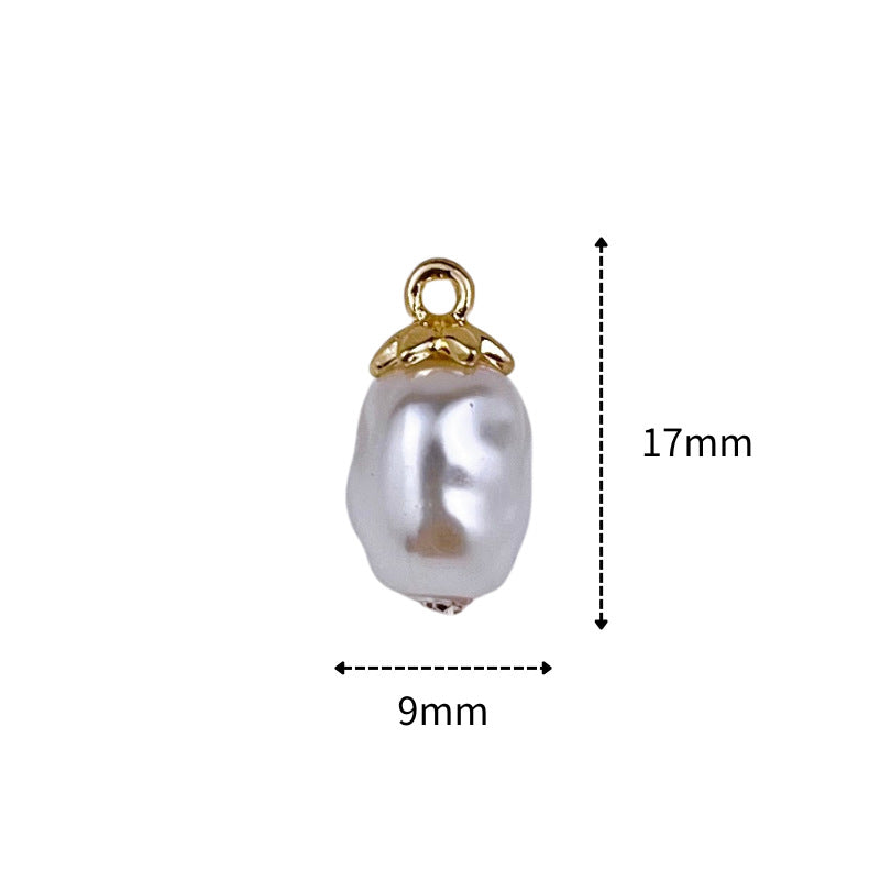 Pearl-shaped button, silvery white oval with gold ring shank; size 9mm x 17mm