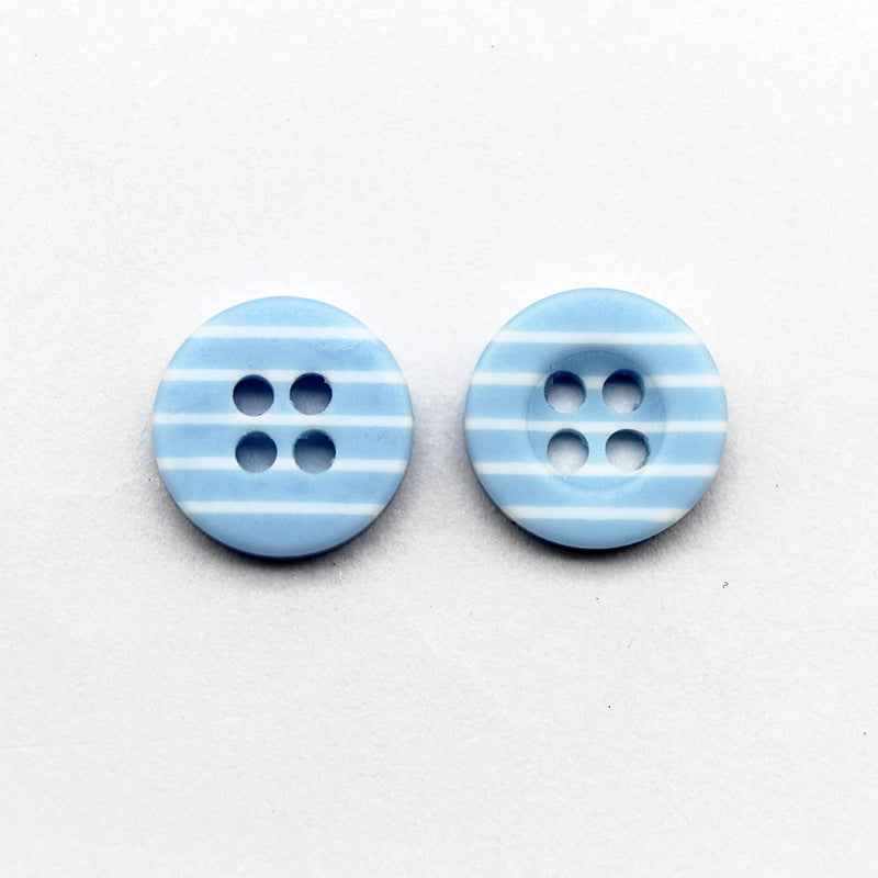 Pair of light blue striped resin buttons with four holes