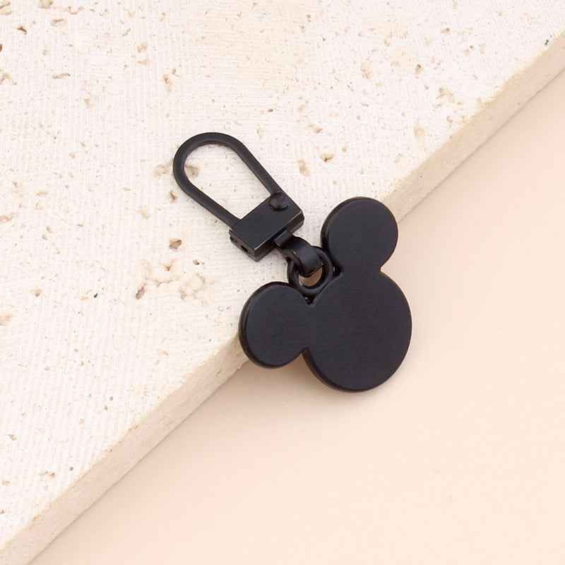 Black bear-shaped zipper pull replacement with loop handle and metal clip