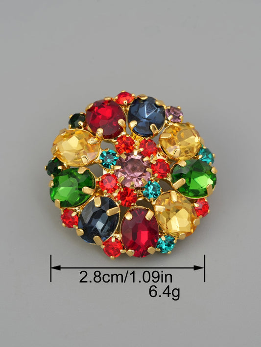 Decorative glass and copper prong button with multicolor faceted stones, centered.