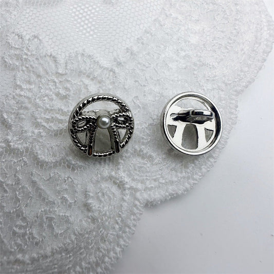 Silver French vintage hollow bow shirt button with faux pearl center, 11.5mm back view