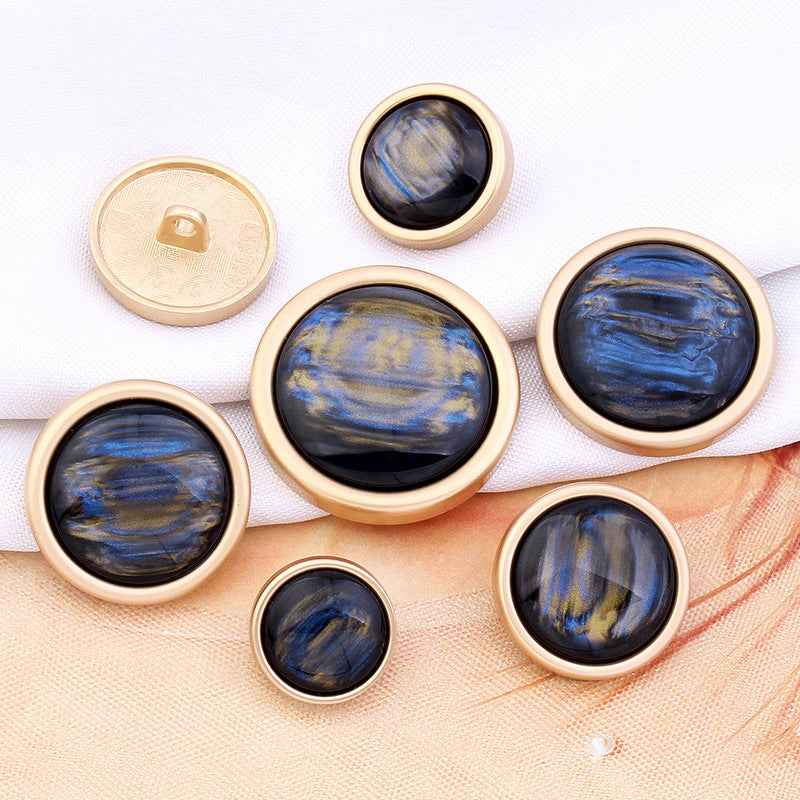 Blue-black cat’s eye gemstone shank button with gold rim, round face, 15–28mm