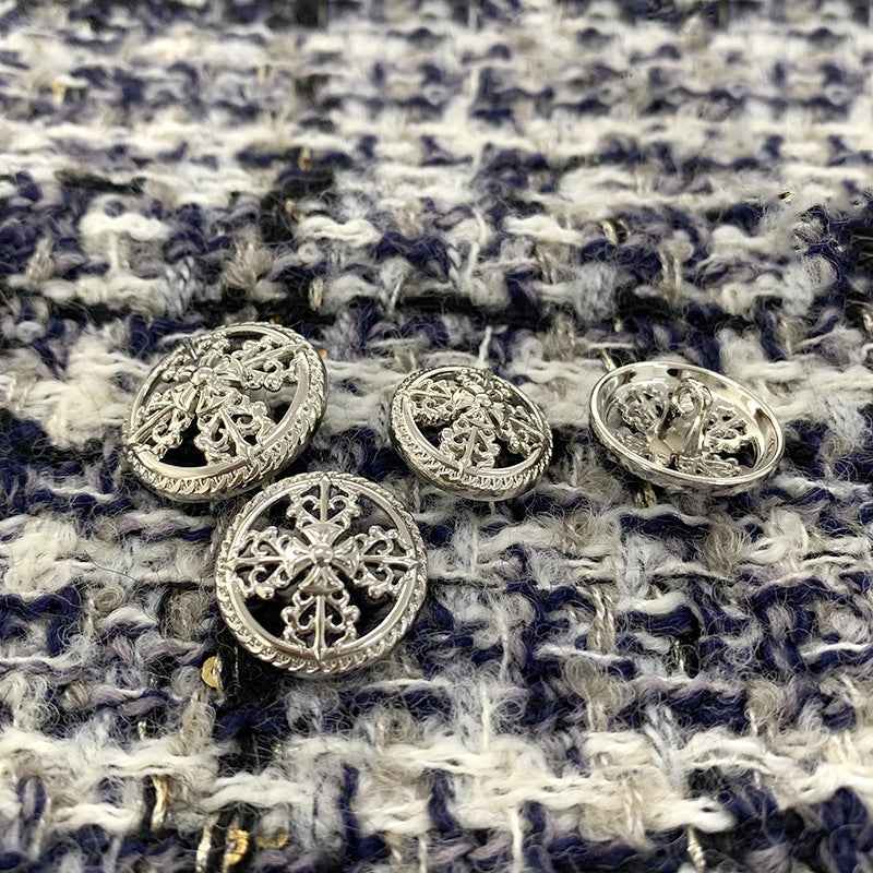Round silver vintage hollow cross metal shank buttons, several pieces laid out