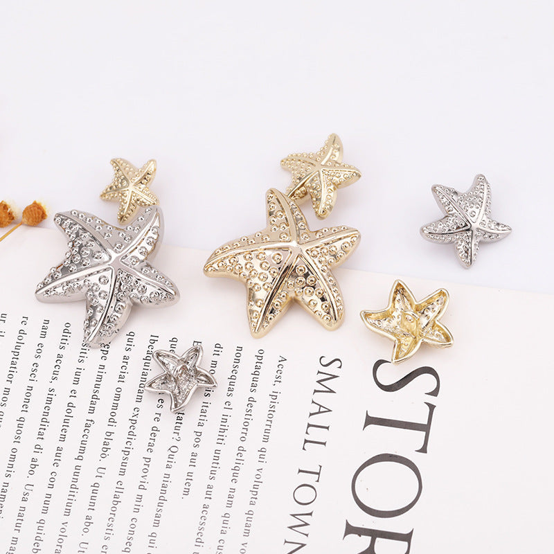 Assorted metal starfish shank buttons in light gold and nickel silver