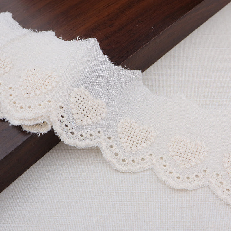 White cotton lace trim with hollow heart embroidery and scalloped edge