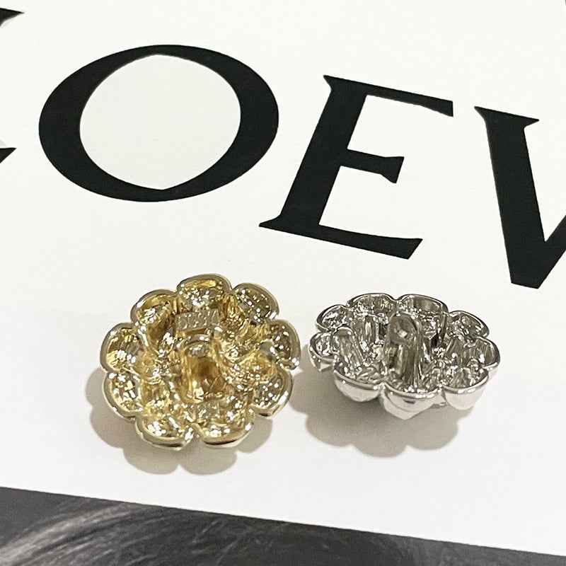 Gold and silver spiral flower metal shank buttons, paired view