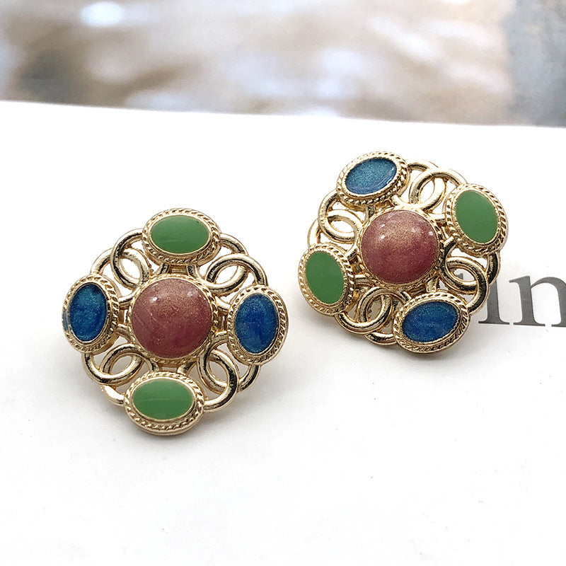 Square metal shank pearl buttons with green and blue centers, pinkish center pearl