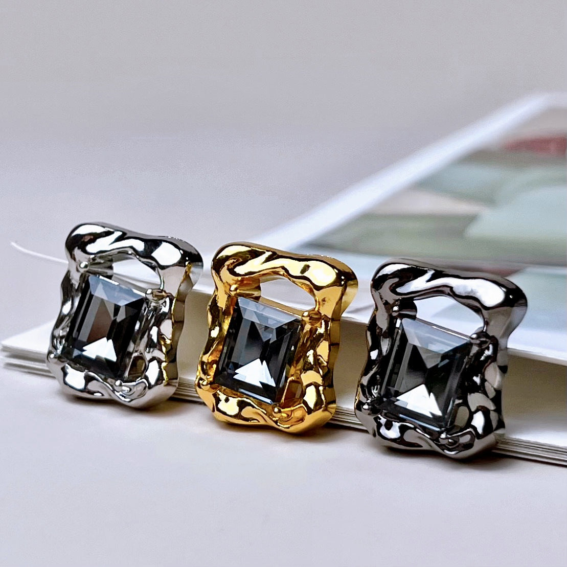 Three beveled diamond rectangular hollow metal buttons in silver, gold, and gunmetal