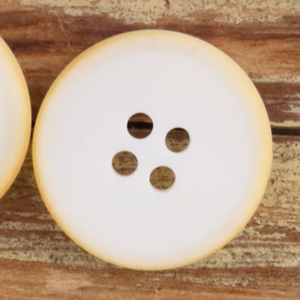 White round 4-hole matte natural nut button with four brown holes