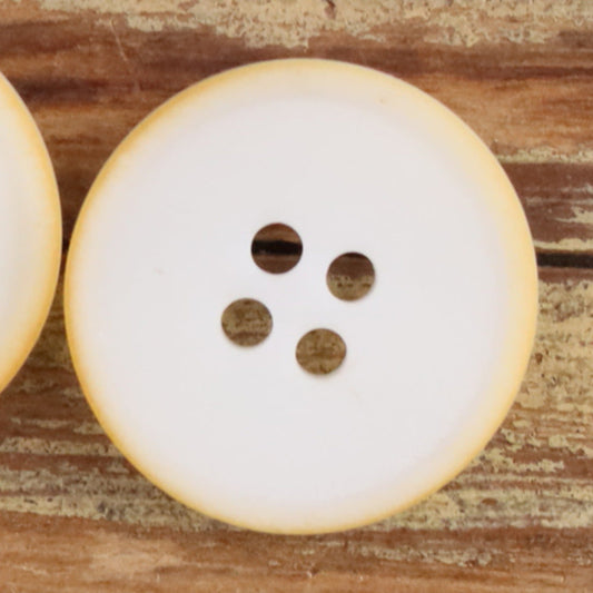 White round 4-hole matte natural nut button with four brown holes