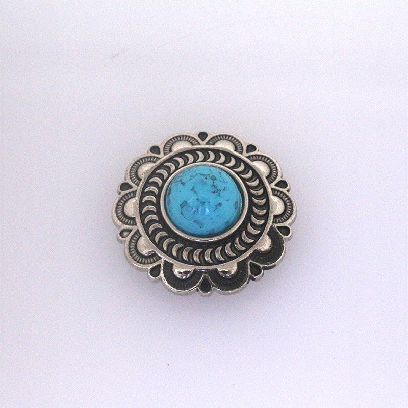 Turquoise metal stud button with large round blue center and scalloped metal border