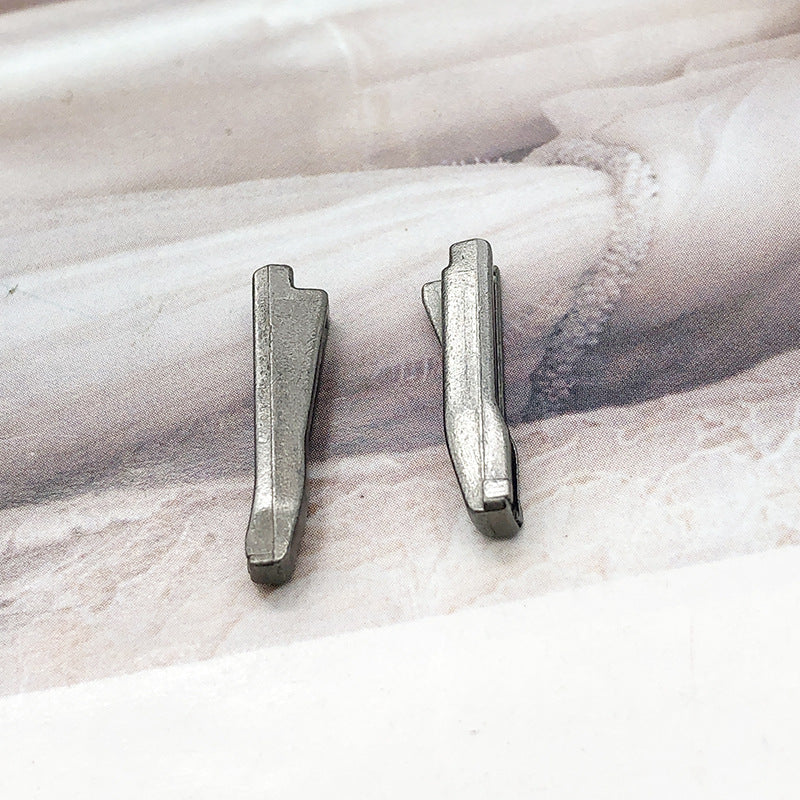 Pair of silver-tone #5 zipper slider retainers, compact metal replacement parts