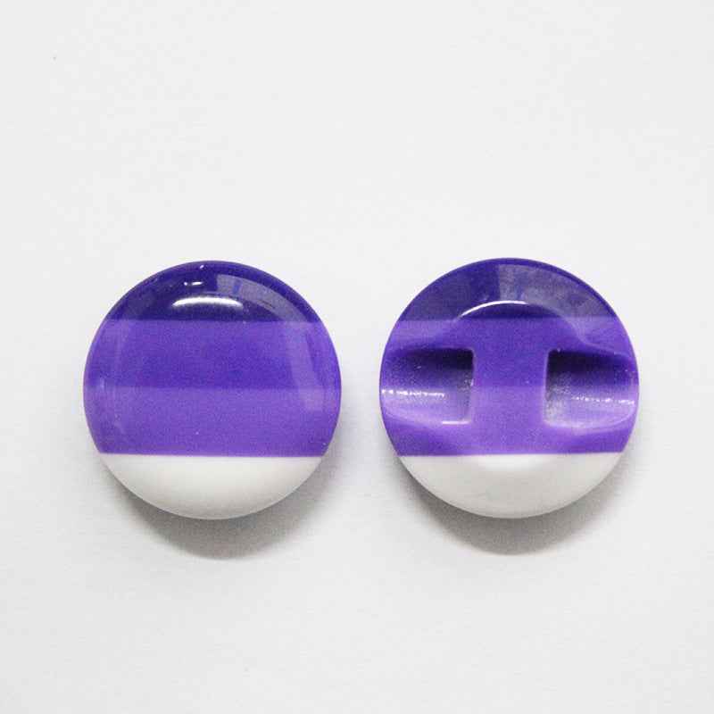 Colorful striped resin buttons with purple top and hidden-hole cross cutout detail