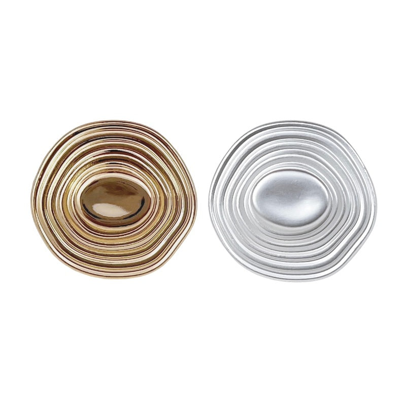 Gold 3D spiraled hat-shaped metal button with glossy oval center