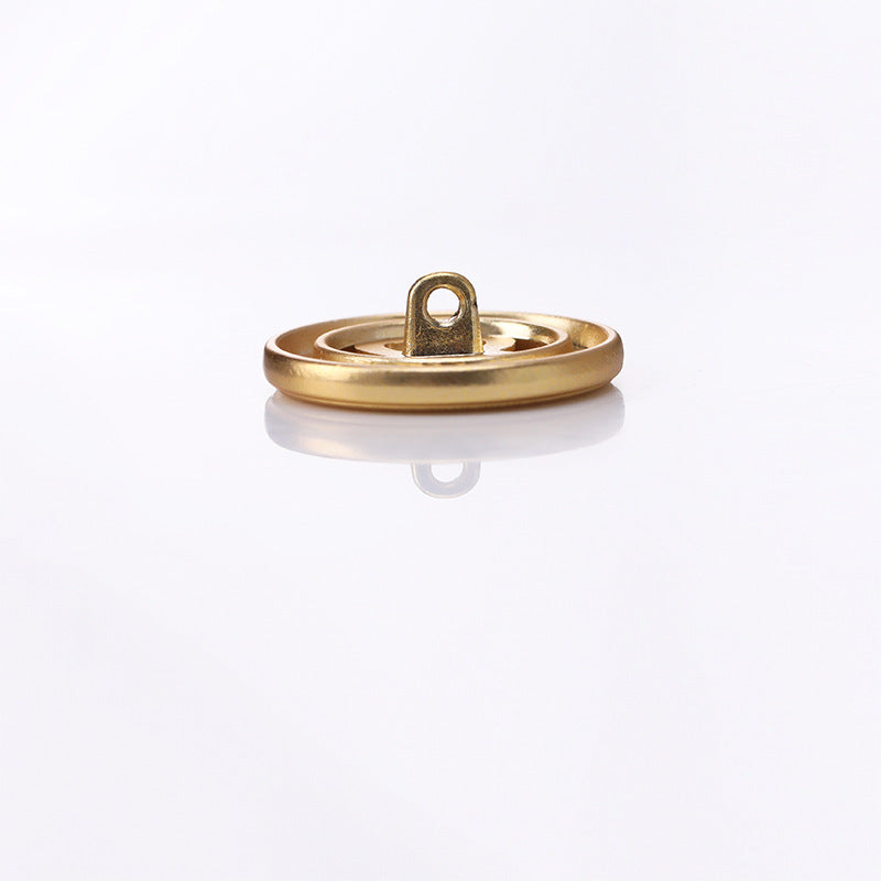 Gold metal shank button underside with raised loop shank