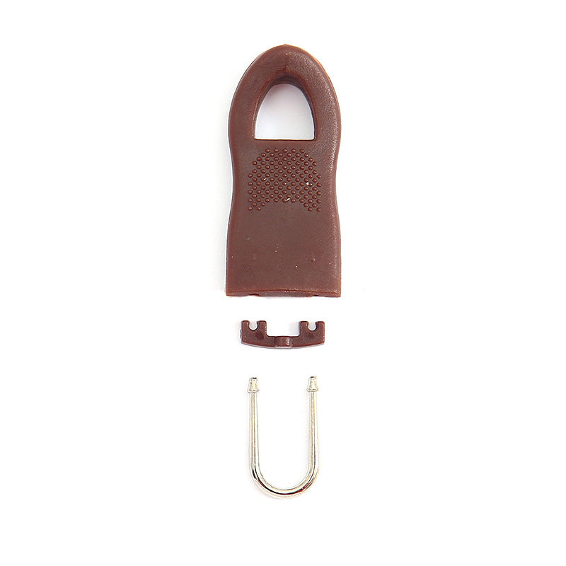 Brown detachable zipper pull with perforated grip, U-shaped metal bolt, and base clip