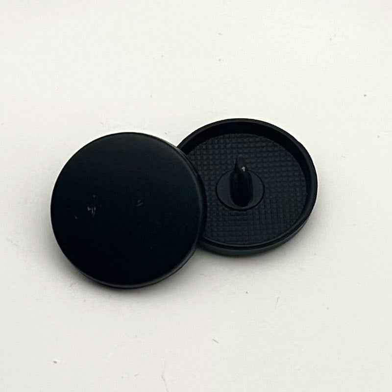 Black round flat metal shank button, front and back view