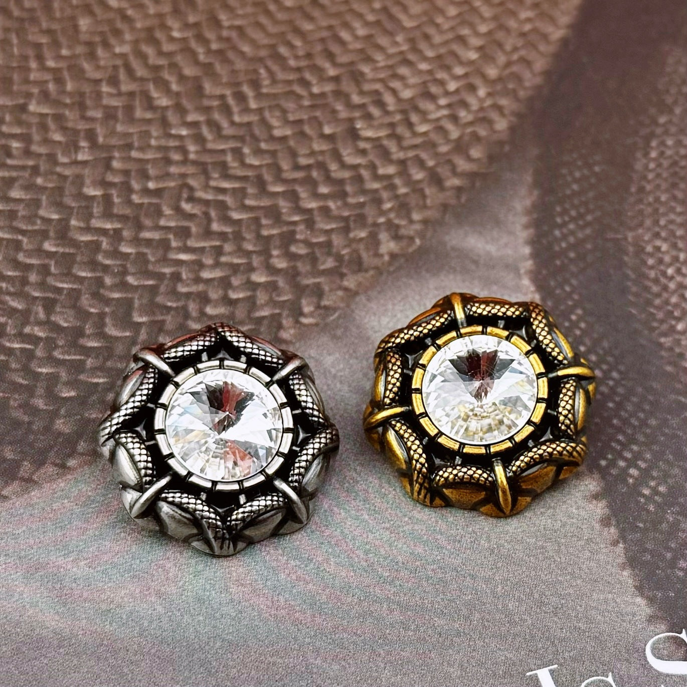 Two vintage snake-edge buttons with white rhinestone center, antique-gold and antique-silver frames