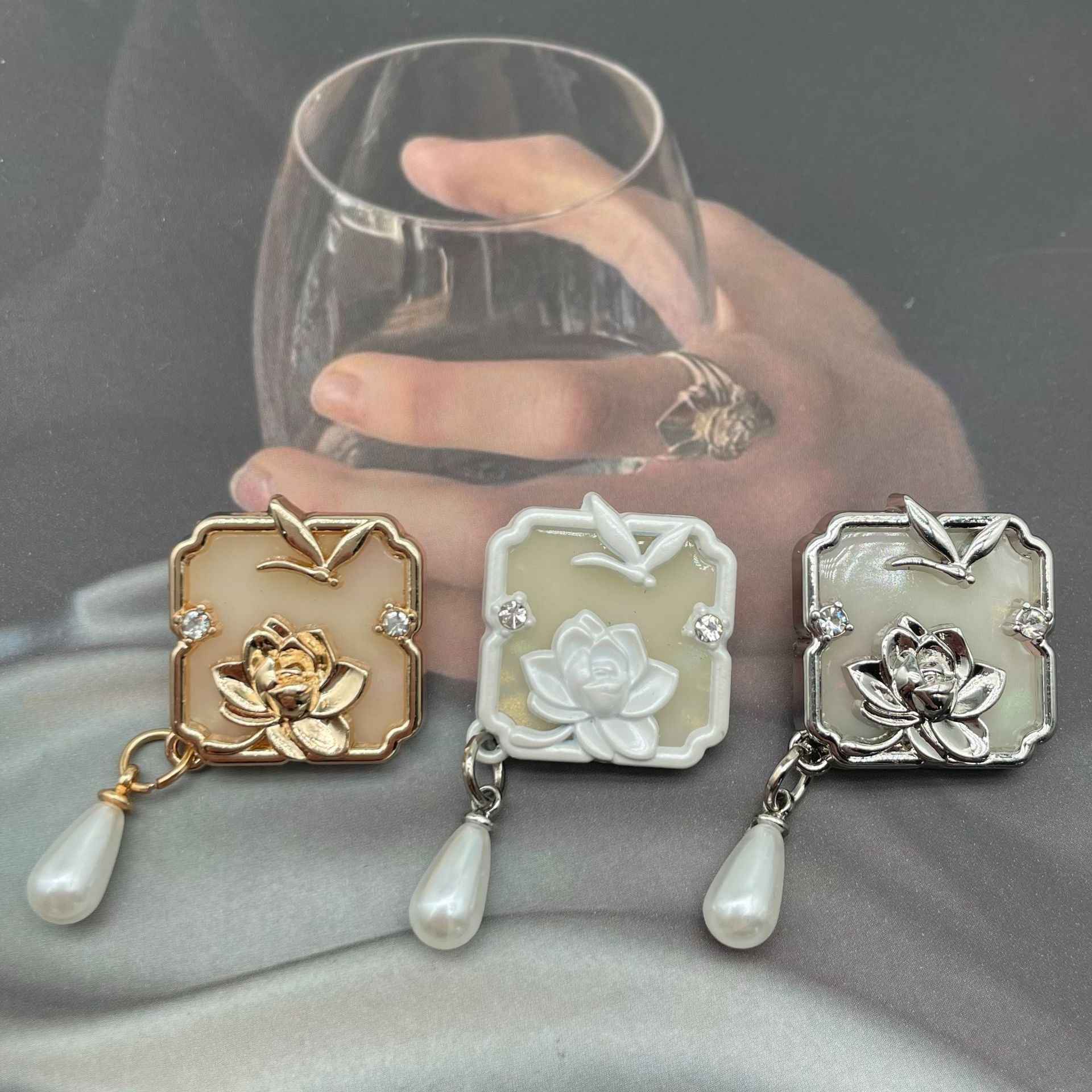 Set of 1-inch metal sew-on buttons in gold, white, and silver with lotus-dragonfly designs