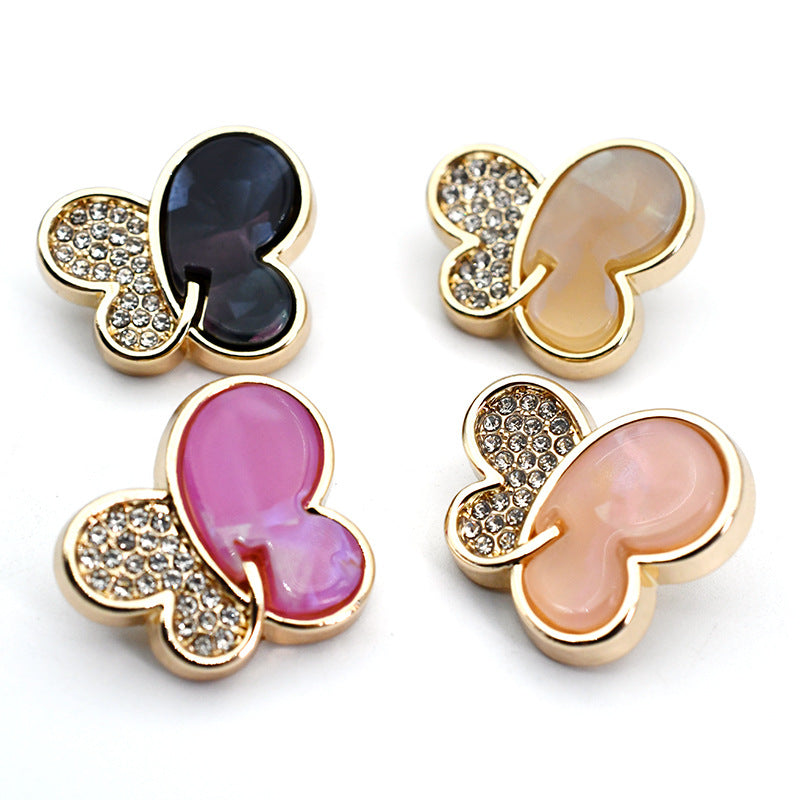 Butterfly rhinestone shank buttons: black, pink, and gold-tone settings