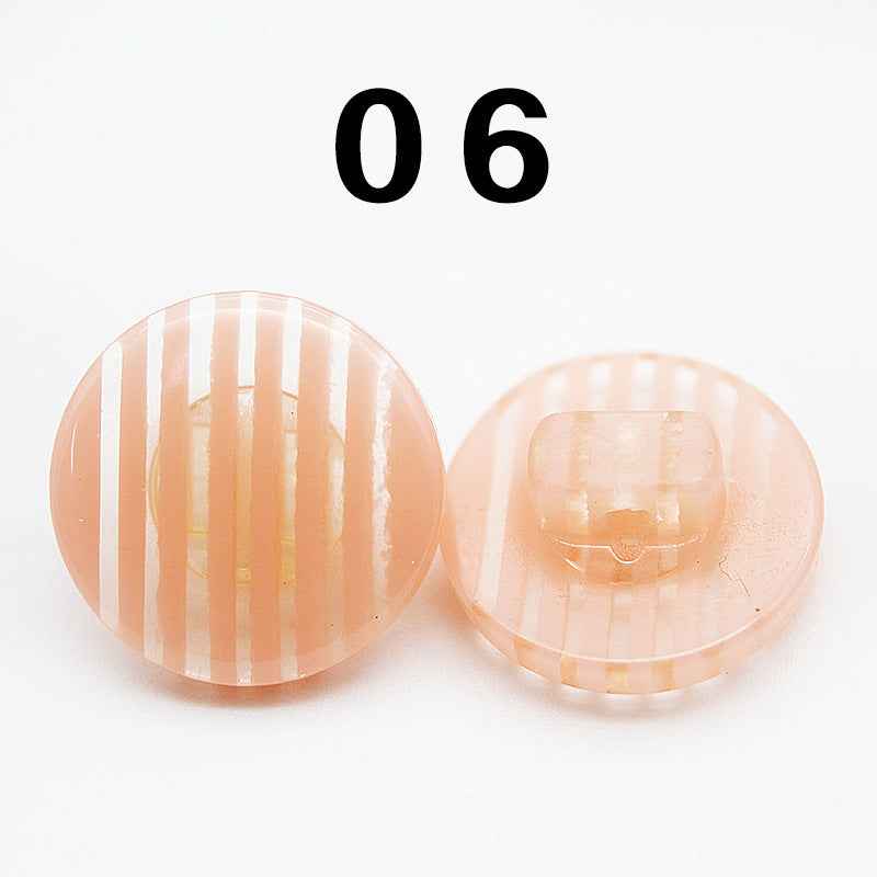 Color 06: peach striped resin shirt button, round shank, front and back.