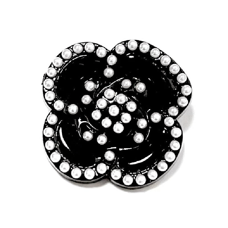 Black camellia pearl heart shank button with white pearl dot accents around edge