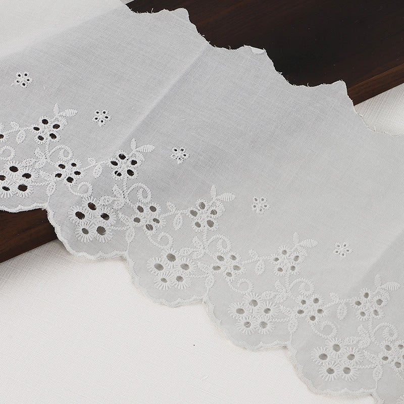 White cotton embroidered lace trim with floral embroidery and scalloped lace border
